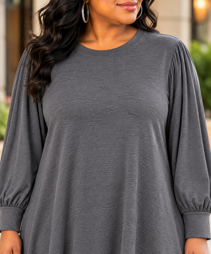 Close-up of charcoal gray dress neckline and sleeves