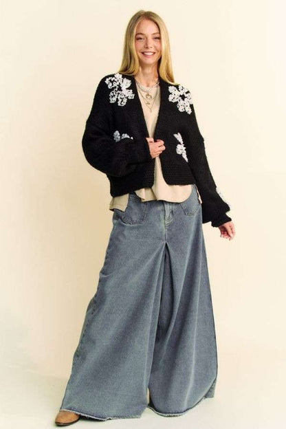 Front full-length view of Davi & Dani black floral appliqué cropped cardigan