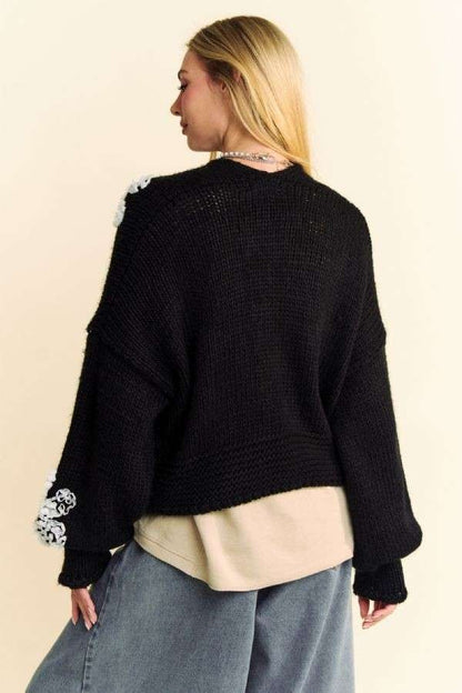 Back close-up of Davi & Dani chunky-knit cardigan