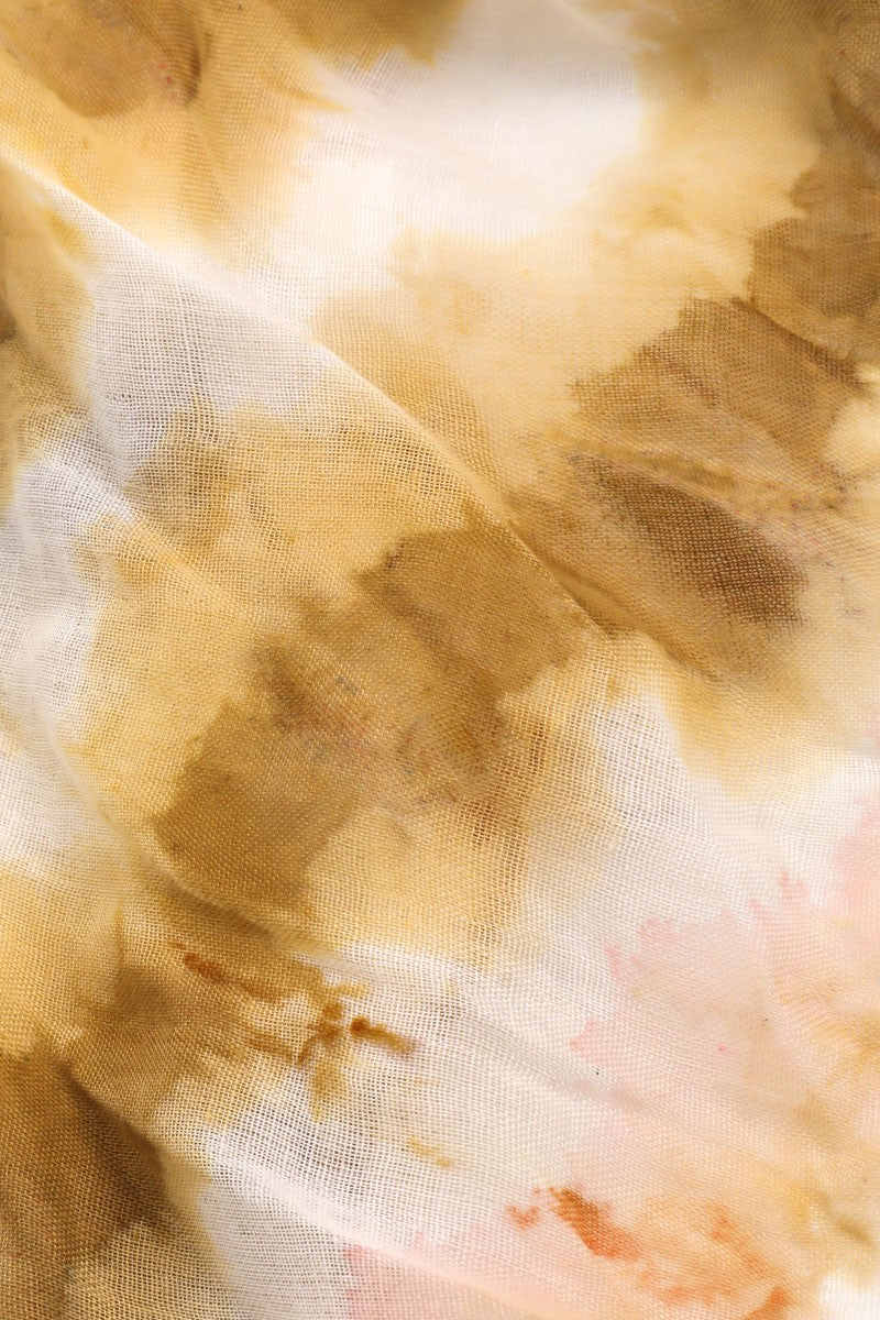 Fabric detail of camel cream and blush tie dye scarf